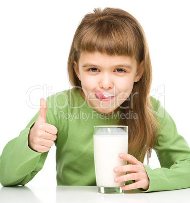 Cute little girl showing milk moustache