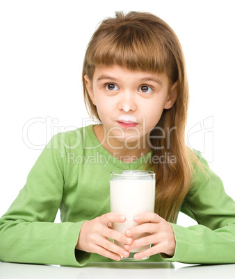 Cute little girl with a glass of milk