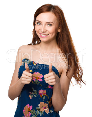 Woman is showing thumb up gesture