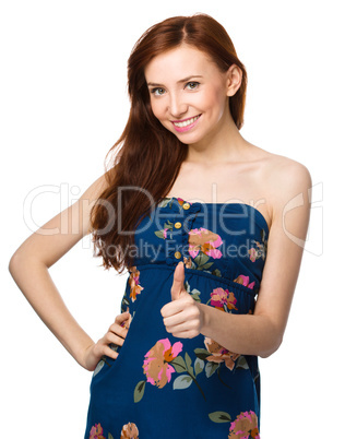 Woman is showing thumb up gesture