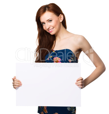 Young woman is holding blank banner