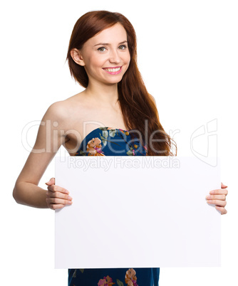 Young woman is holding blank banner