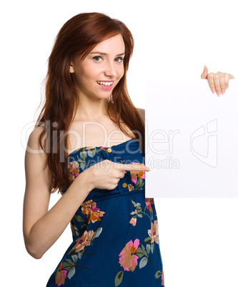 Young woman is holding blank banner