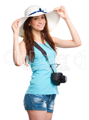 Young woman wearing summer hat