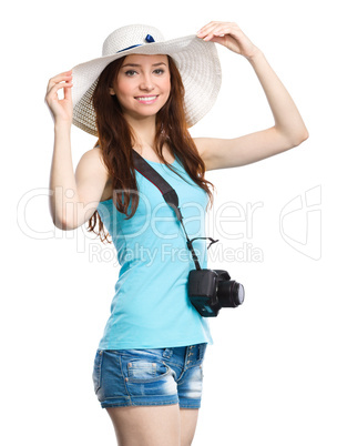 Young woman wearing summer hat