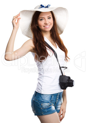 Young woman wearing summer hat