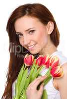 Young woman is holding bouquet of tulips