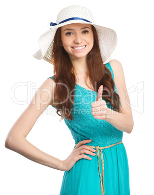 Woman is showing thumb up gesture