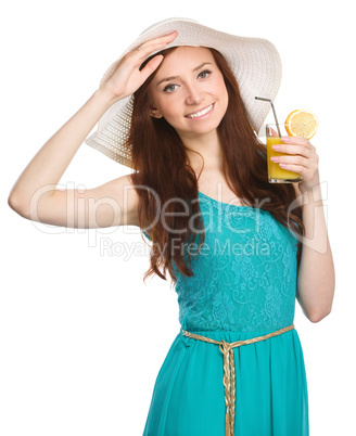 Young woman wearing summer hat