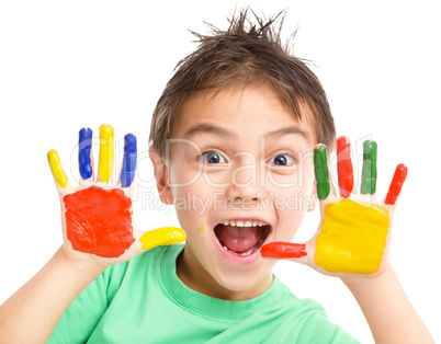 Portrait of a cute boy playing with paints Portrait of a cute boy playing with paints