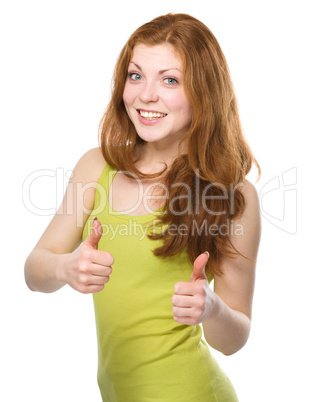 Woman is showing thumb up gesture