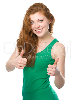 Woman is showing thumb up gesture