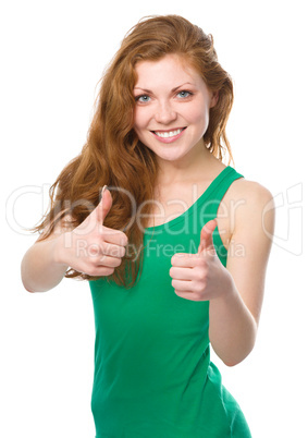 Woman is showing thumb up gesture