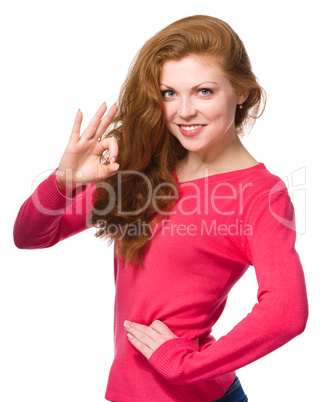 Woman is showing OK sign