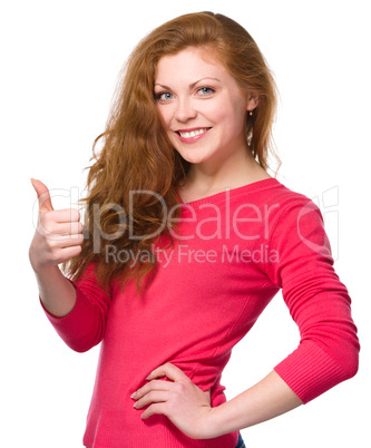 Woman is showing thumb up gesture