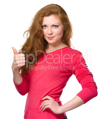 Woman is showing thumb up gesture