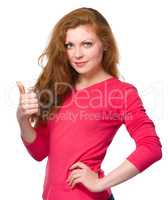 Woman is showing thumb up gesture