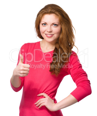 Woman is showing thumb up gesture