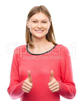 Woman is showing thumb up gesture