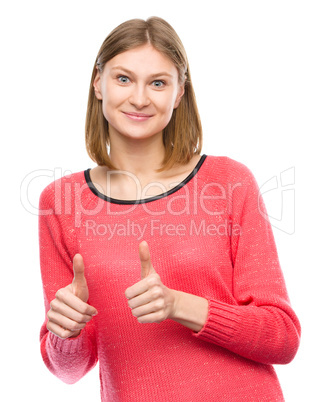 Woman is showing thumb up gesture