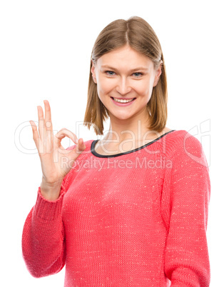 Woman is showing OK sign