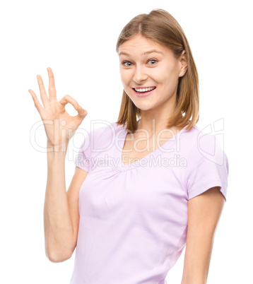 Woman is showing OK sign