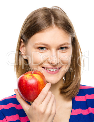 Young happy girl with apple