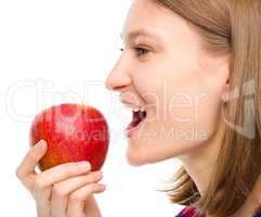Young happy girl with apple