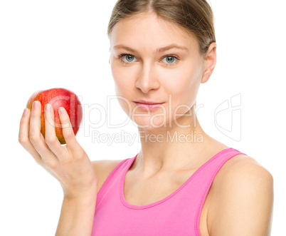 Young happy girl with apple