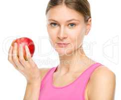 Young happy girl with apple