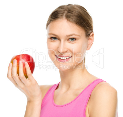 Young happy girl with apple Young happy girl with apple