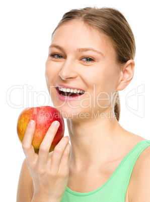 Young happy girl with apple