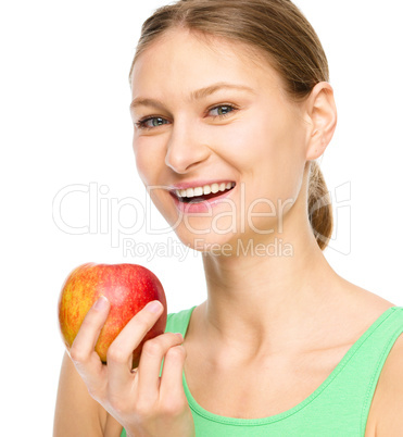 Young happy girl with apple