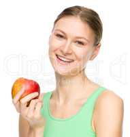 Young happy girl with apple