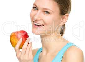 Young happy girl with apple