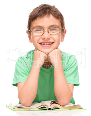 Little boy is reading a book Little boy is reading a book