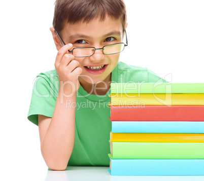 Little boy is reading a book