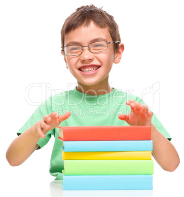 Little boy is reading a book