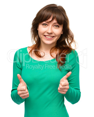 Woman is showing thumb up gesture