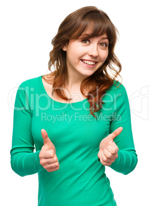 Woman is showing thumb up gesture