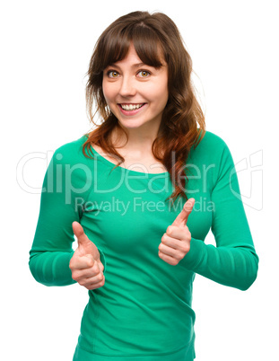 Woman is showing thumb up gesture