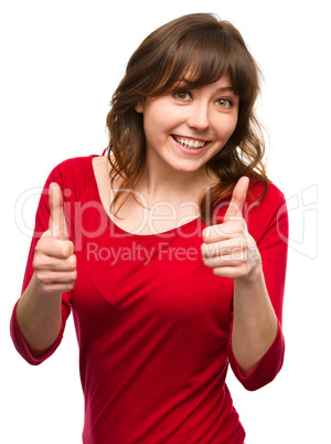 Woman is showing thumb up gesture