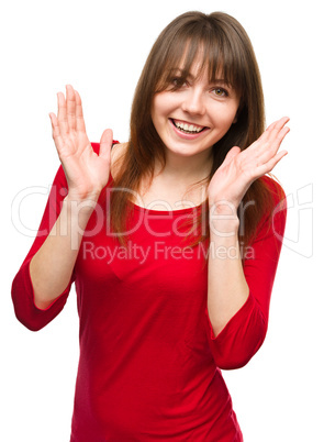 Portrait of a young woman raised her hands up