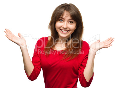 Portrait of a young woman raised her hands up