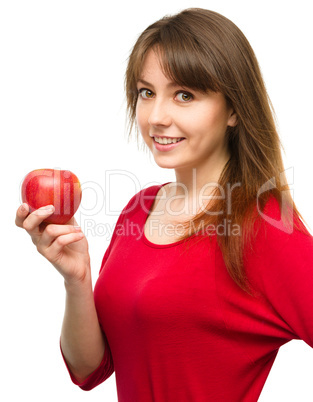 Young happy girl with apple