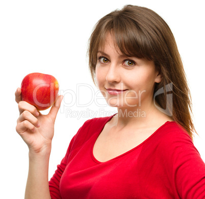 Young happy girl with apple