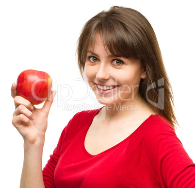 Young happy girl with apple