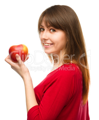 Young happy girl with apple