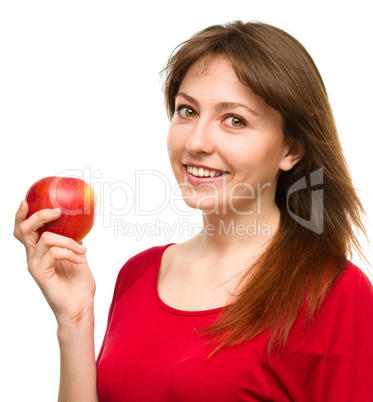 Young happy girl with apple