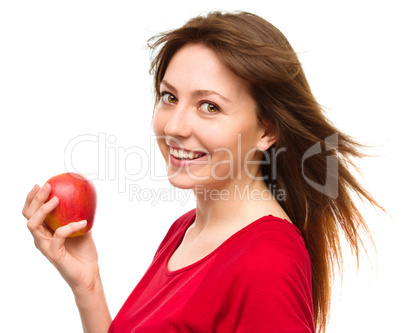 Young happy girl with apple